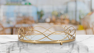 Portaoggetti in metallo dorato con piano in vetro Ø cm 27,5x7