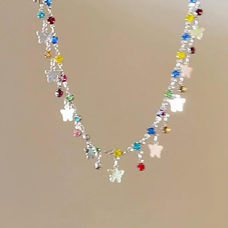 Collana a farfalla e stella realizzata a mano con perline: ciondolo con zirconi colorati