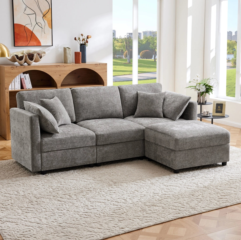 Divano angolare modulare a L con pouf; 3-4 posti; in tessuto Chenille grigio 218 x 156;5 x 86 cm