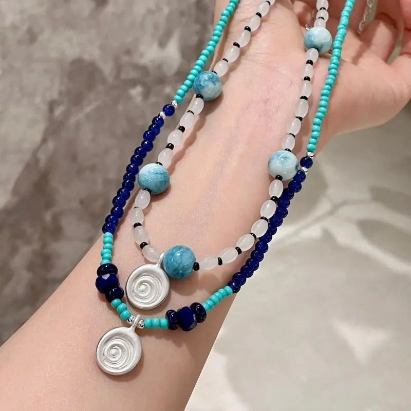 Collana con ciondolo a forma di conchiglia in pietra naturale: gioielli boho con perline