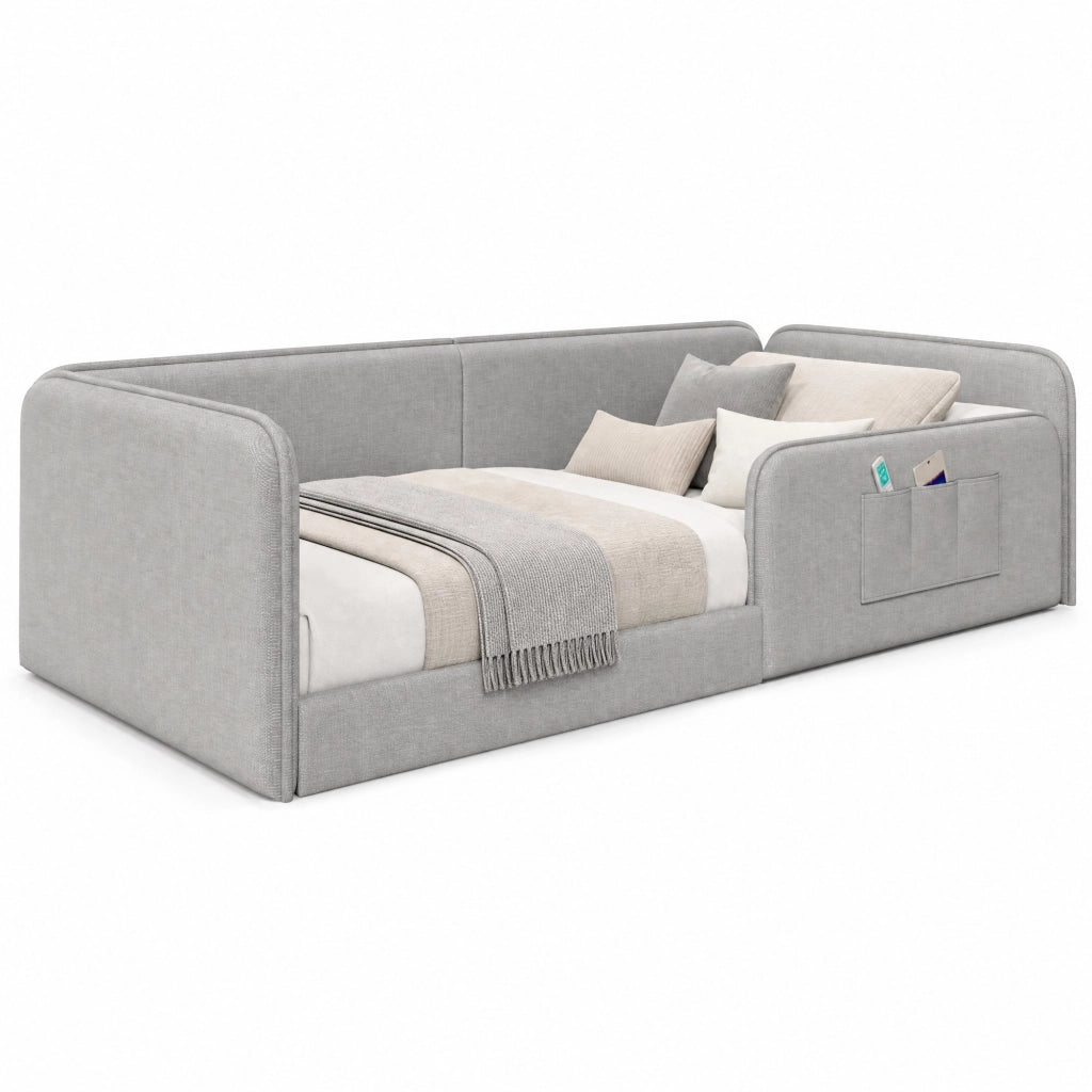 Letto a piattaforma 90x200 cm con rivestimento in lino e tasche laterali; grigio