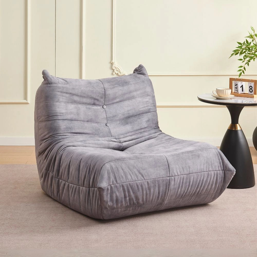 Poltrona in morbida schiuma e rivestita in tessuto grigio chiaro Horace – Comfort e relax in ogni ambiente