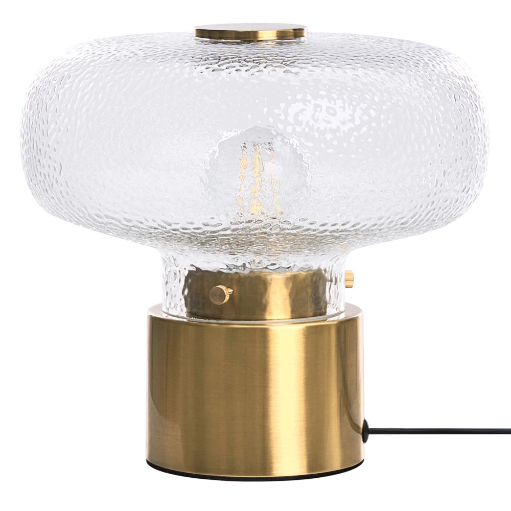 Lampada da tavolo con base in ottone e paralume in vetro testurizzato trasparente; design moderno e glamour per il soggiorno