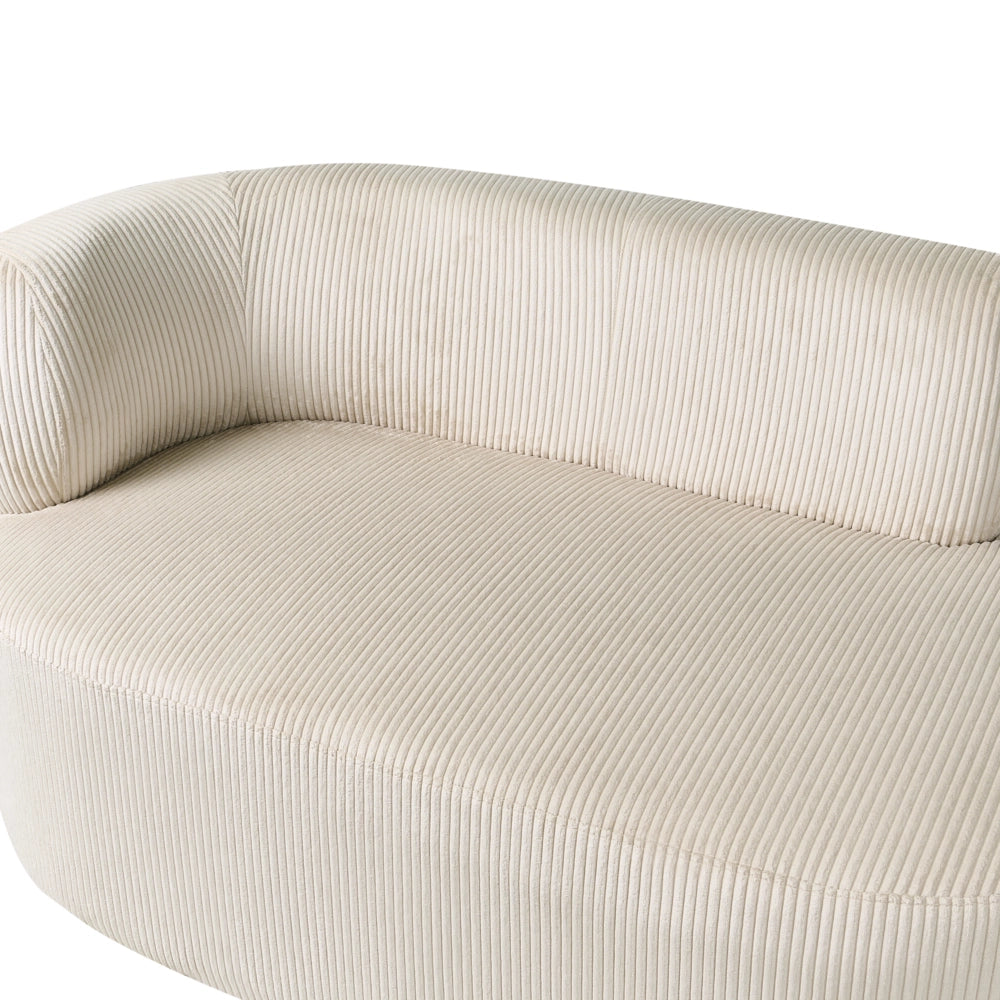 Chaise longue con rivestimento in velluto a coste beige e cuscino decorativo lato sinistro