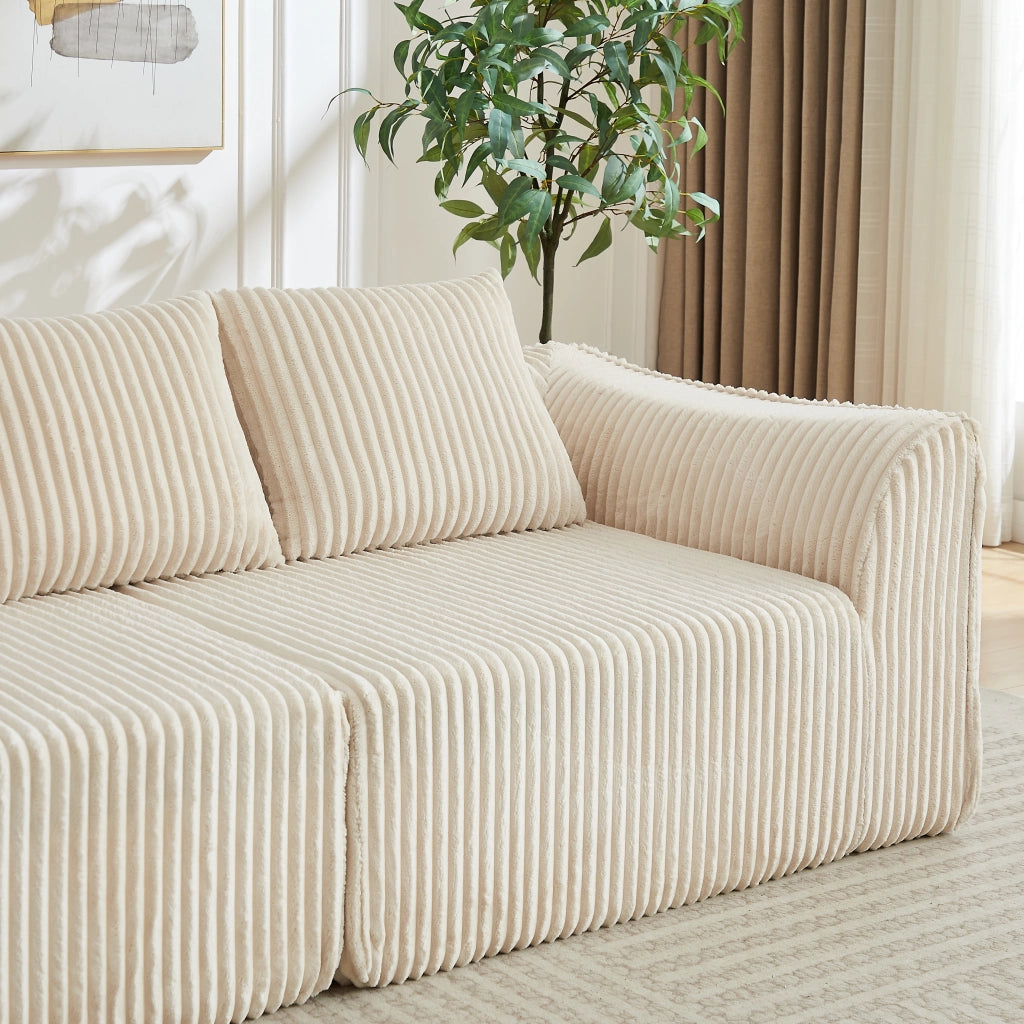 Divano modulare in ciniglia con braccioli e schienale curvi, seduta ampia e imbottitura in schiuma beige