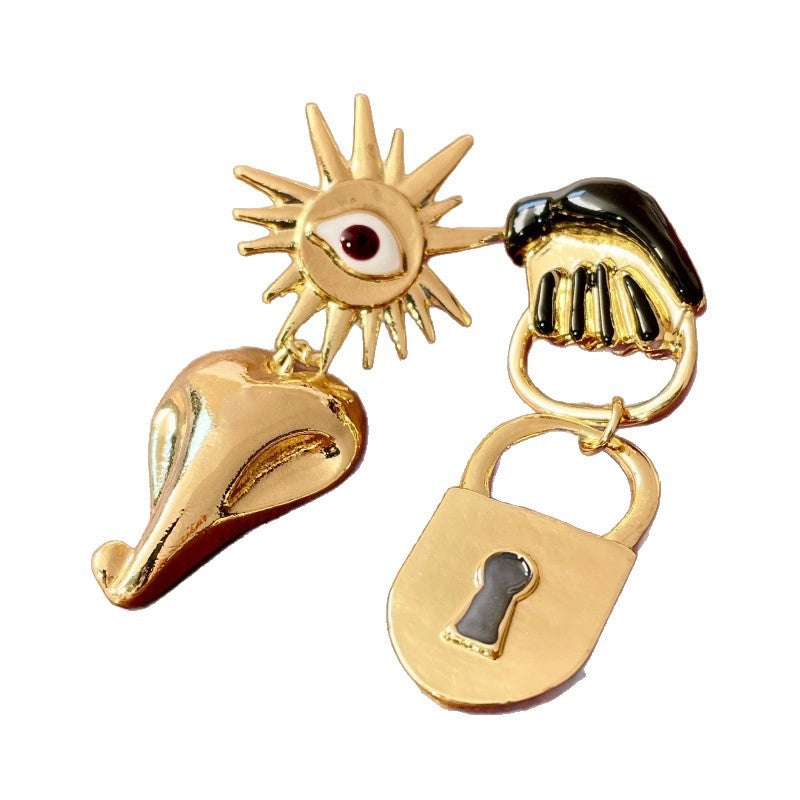 Orecchini vintage asimmetrici a forma di occhio di girasole