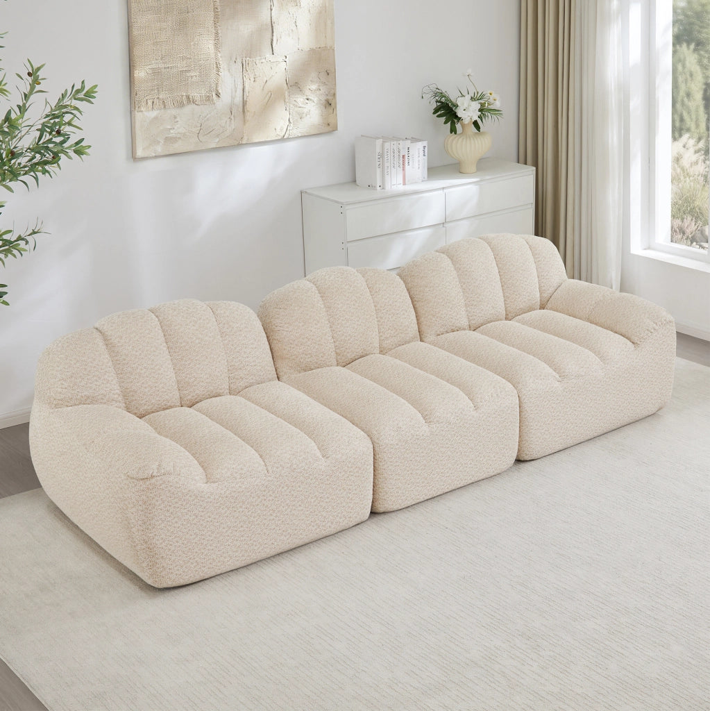 Divano modulare 2-4 posti con ottomano in pile granulato e schiuma 32D; beige bianco