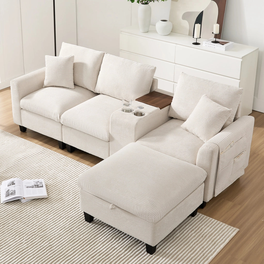 Divano angolare 229x149.5x83 cm con console centrale; porte USB e tasche portaoggetti in corduroy beige