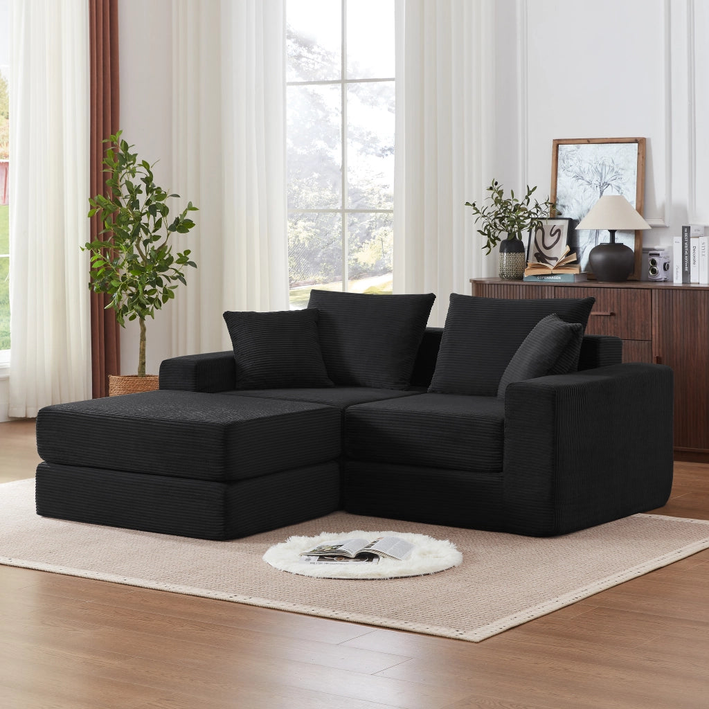 Divano modulare trasformabile in letto matrimoniale con braccioli oversize e base antiscivolo in tessuto a coste nero