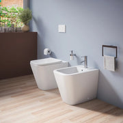 Coppia sanitari in ceramica filomuro vaso rimless, bidet e copri-wc bianco opaco | Kyoto