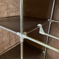 Armadio Vestiario In Tessuto Con Ante Con Cerniera E Tasche Laterali Nyana Home Misure 165x88x45cm Marrone