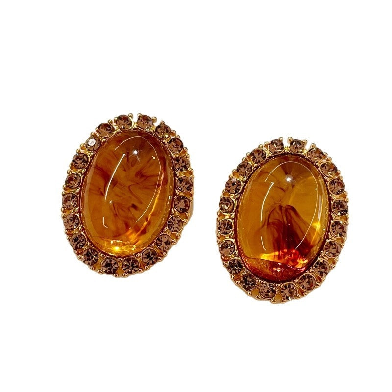 Accessori vintage, sofisticati orecchini di diamanti ispirati all'ambra di Maillard