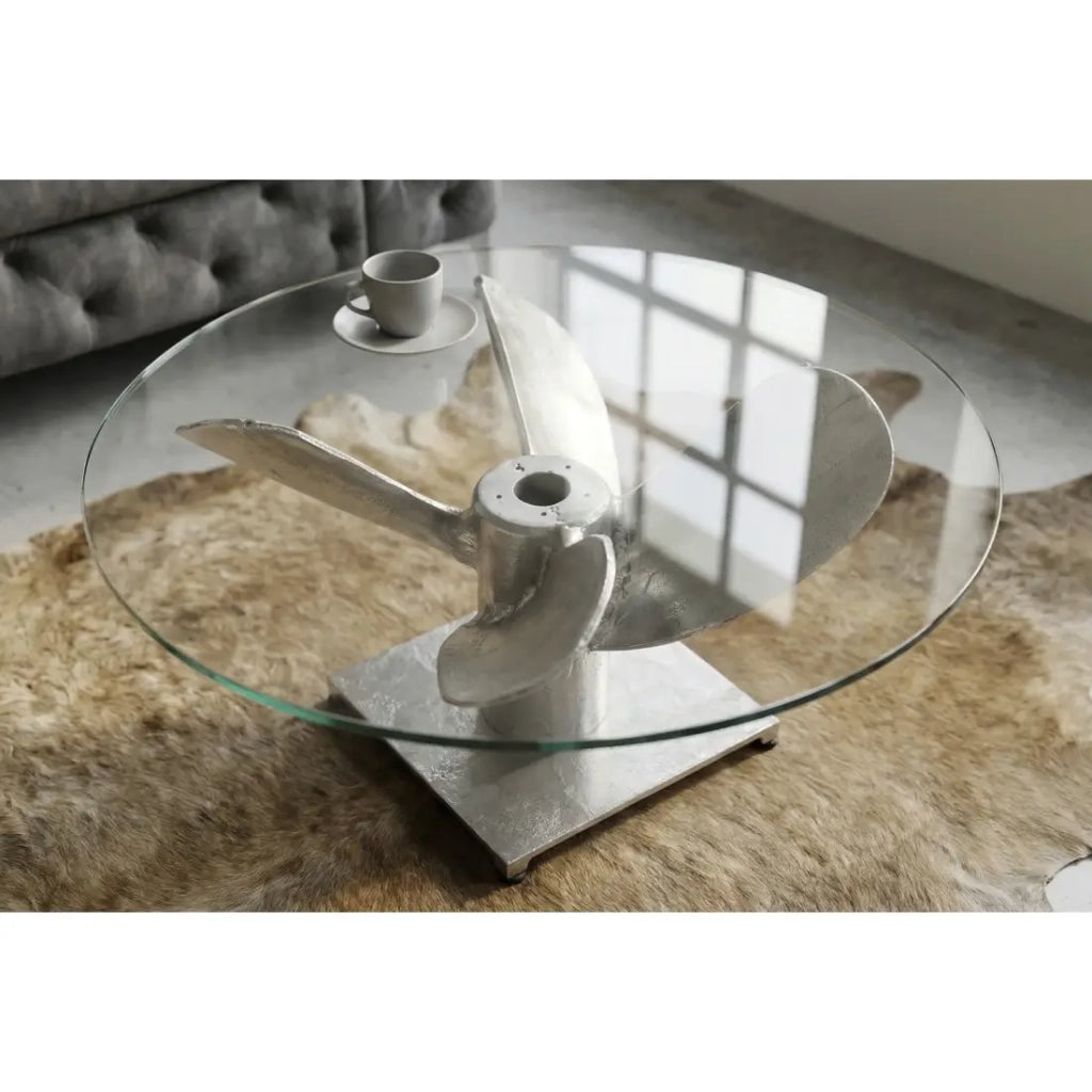Tavolino basso ALUMIA rotondo 70 cm in alluminio argentato e vetro temperato – design industriale con piede a elica