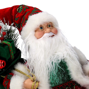 Babbo natale in tessuto bordeaux seduto con musica e movimento cm xh35,5