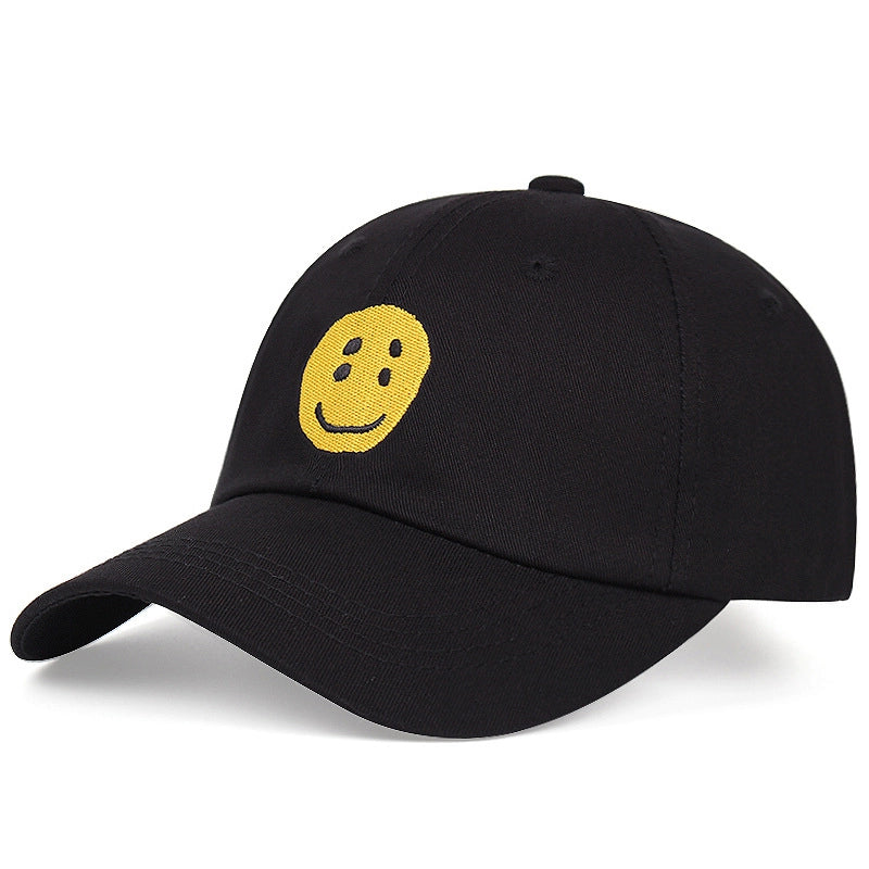 Cappellini da baseball neri in cotone con divertente faccina sorridente ricamata.
