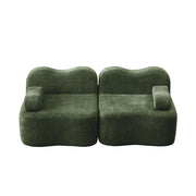 Divano modulare senza struttura a forma ondulata con seduta profonda e pouf collegabile in velluto verde