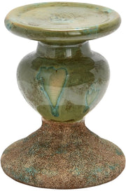 Sostegno per candela in terracotta a forma di scultura, a doppia tonalità, con patina verde mossa.