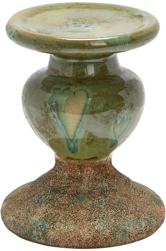 Sostegno per candela in terracotta a forma di scultura, a doppia tonalità, con patina verde mossa.