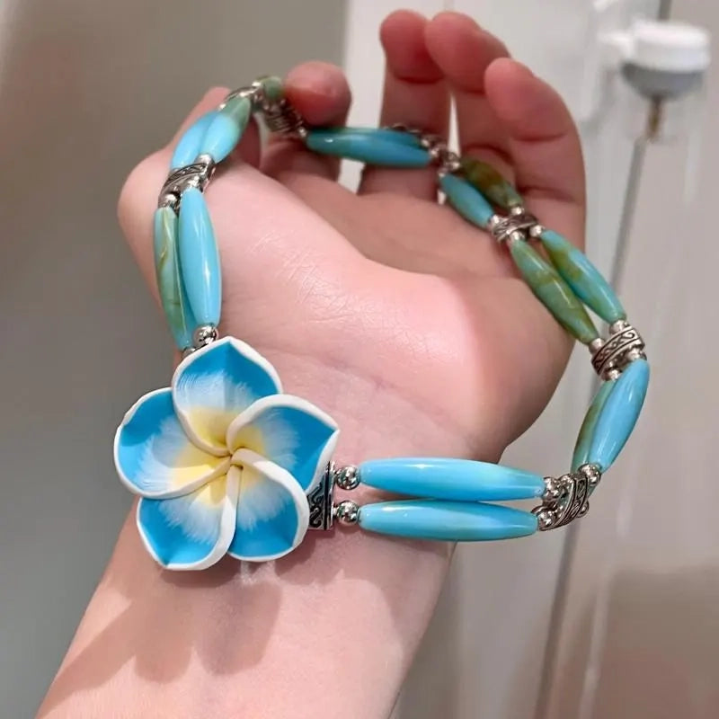 Collana fatta a mano con perline di cristallo e frangipani blu, regalo di Natale o compleanno.