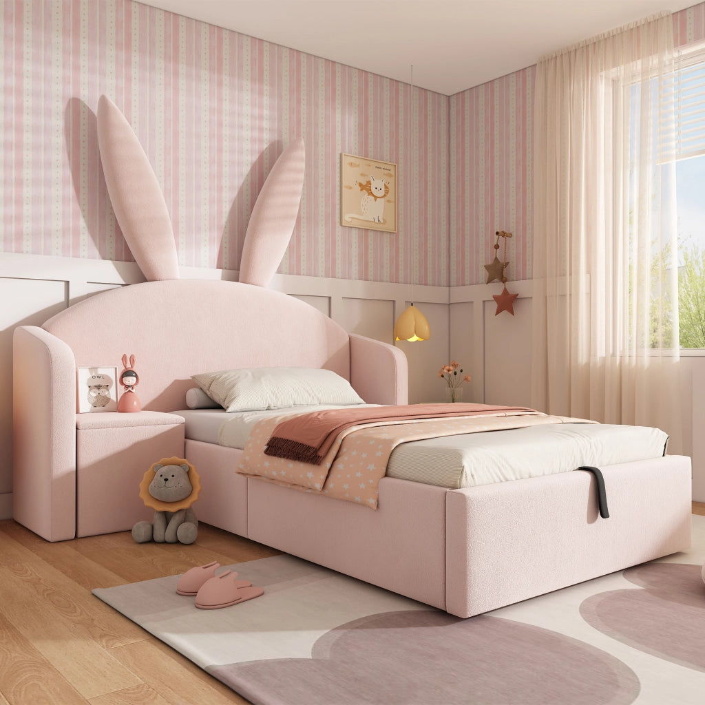 Letto imbottito 90x200 cm rosa con testiera a orecchie di coniglio, comodino contenitore e rete
