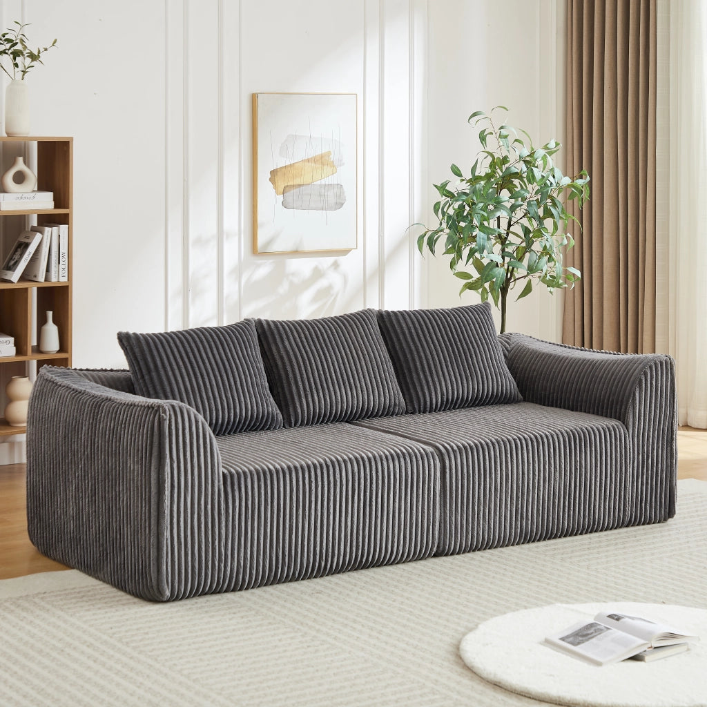 Divano modulare in corduroy con linee curve e schienale avvolgente, seduta ampia e due cuscini per soggiorno grigio