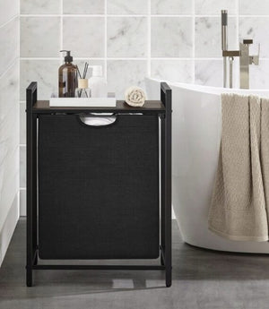 Cesto della biancheria con misure 72x33x50 cm, colore nero, capiente e pratico.