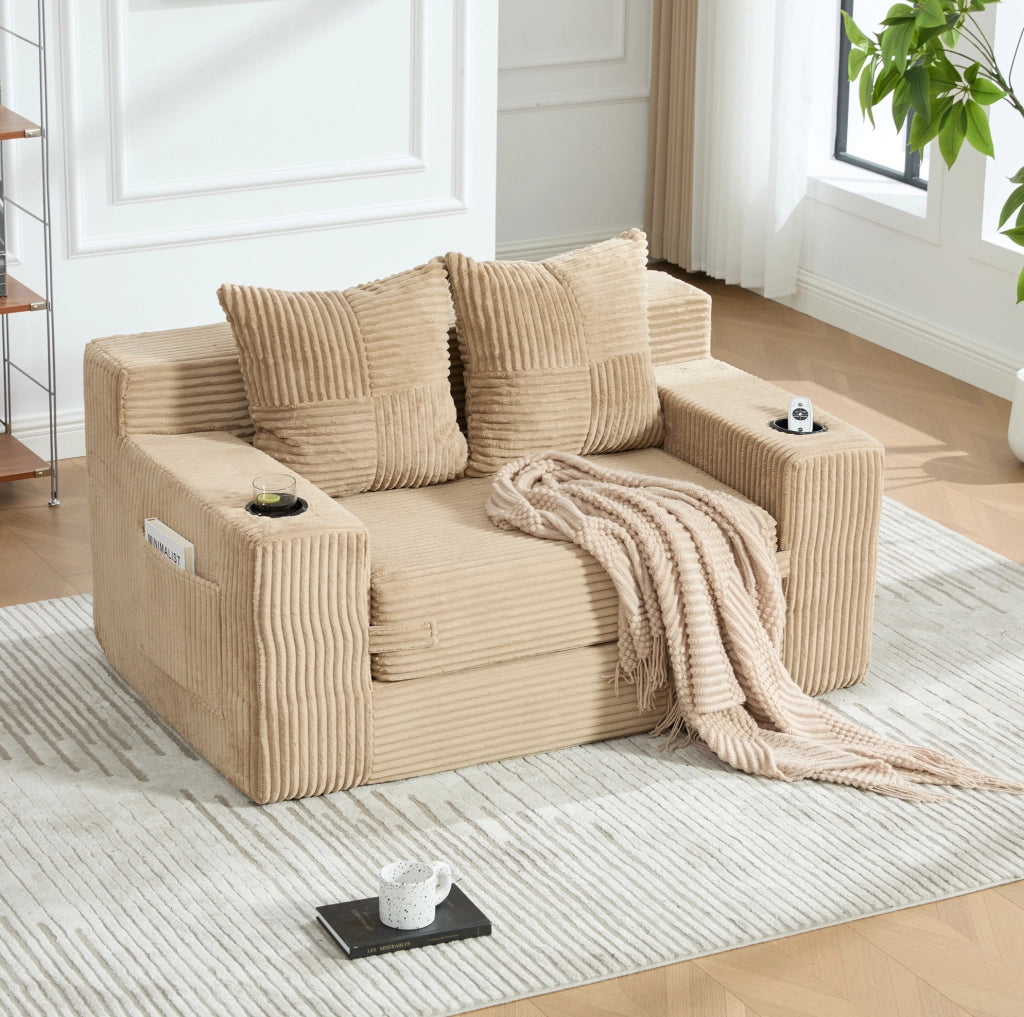 Divano a due posti in corduroy khaki con tasche laterali e 2 cuscini; 151x133x64 cm