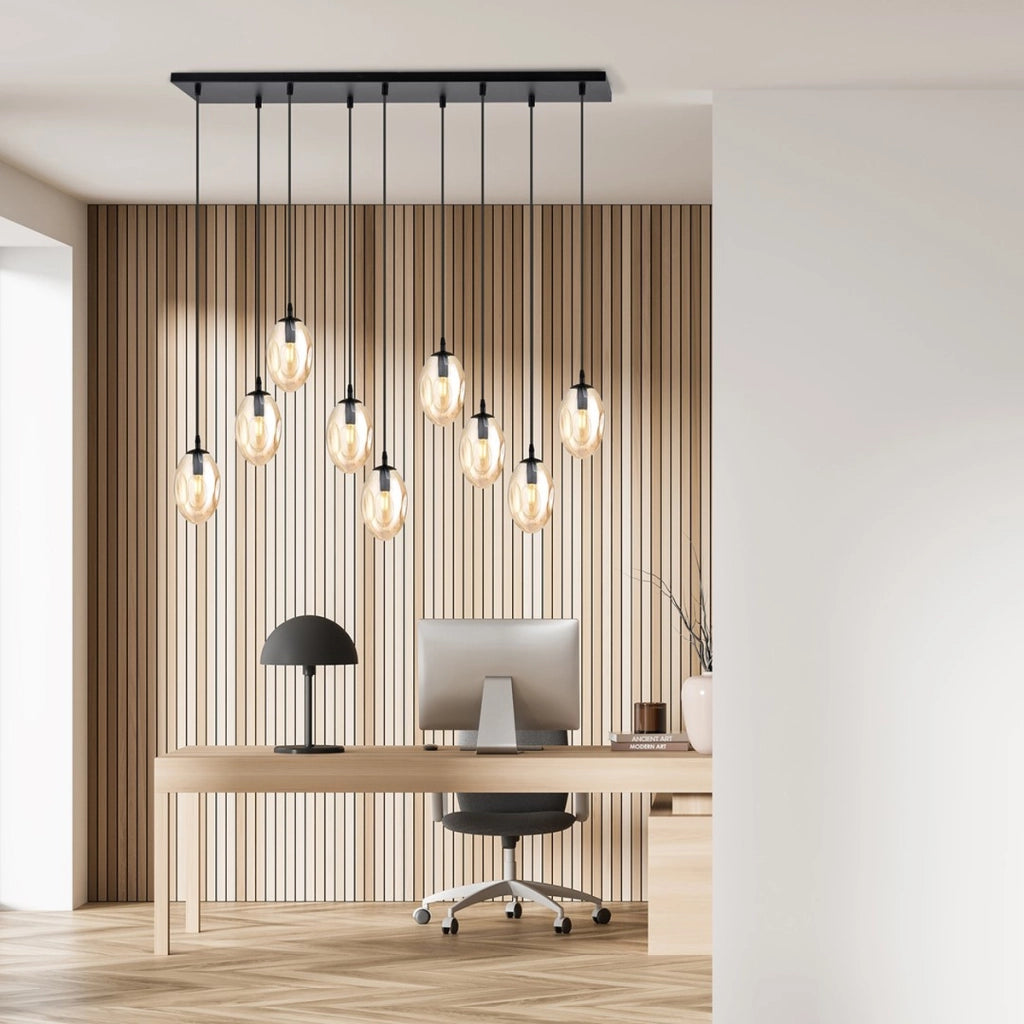 Lampada a sospensione Astral con nove diffusori in vetro ambra