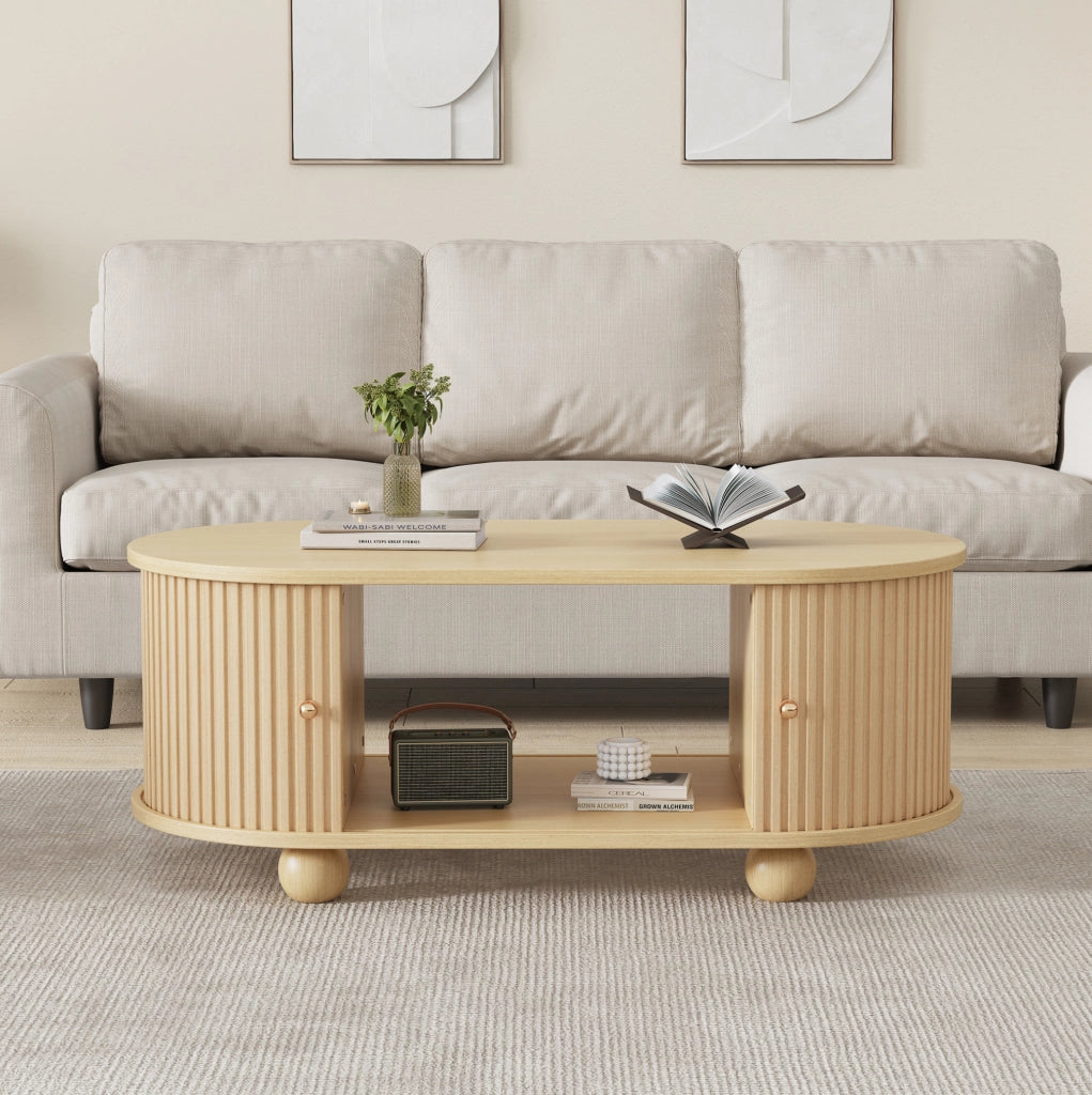 Tavolino da caffè ovale con vano contenitore; ante scorrevoli; 100x50x40 cm; MDF; effetto legno