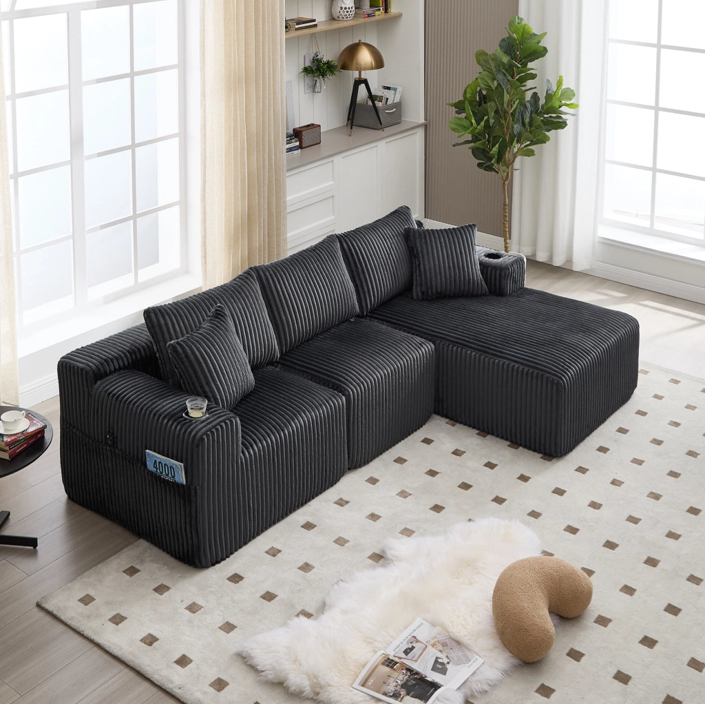 Divano modulare 257x160x62 cm con chaise longue; tasche laterali; portabicchieri e 5 cuscini; in corduroy grigio