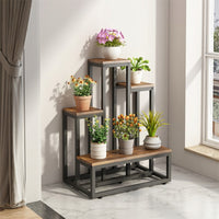 Supporto per piante con misure 51x34x67 cm, colore marrone, ideale per la casa o il balcone.