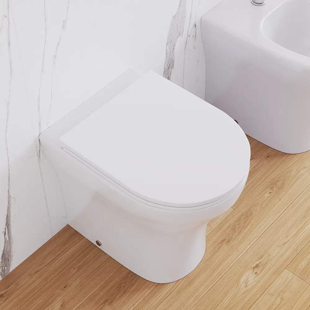 Sanitari filomuro rimless in ceramica bianco lucido: vaso bidet e copriwc soft-close | Nassau