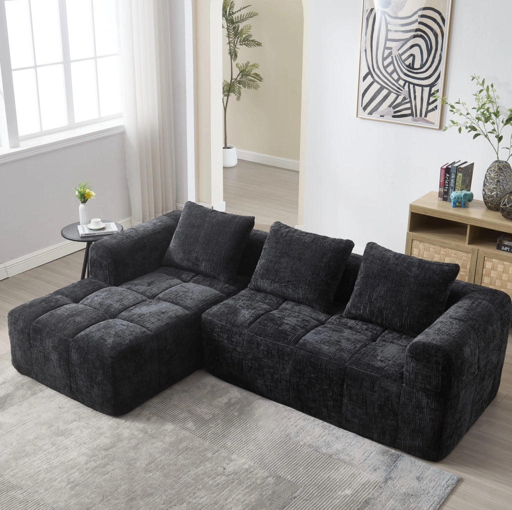 Divano angolare modulare 3 posti in ciniglia nera con chaise longue, tasche laterali e cuscini