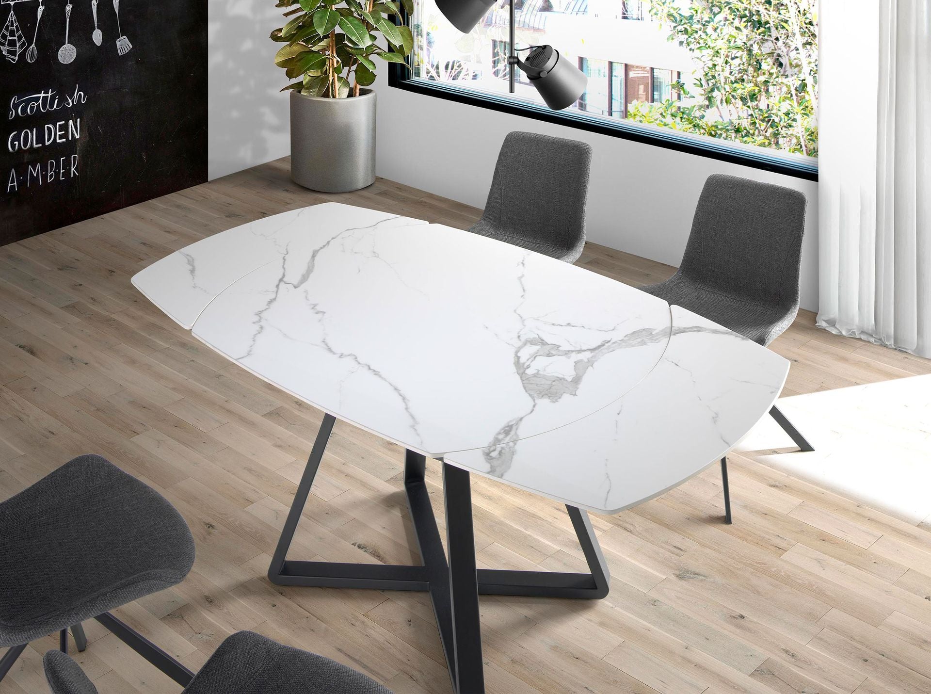 Tavolo da pranzo allungabile barile ovale marmo porcellanato e acciaio nero