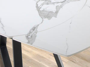 Tavolo da pranzo allungabile barile ovale marmo porcellanato e acciaio nero