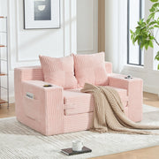 Divano pouf in velluto a coste rosa con due cuscini tasche laterali e braccioli