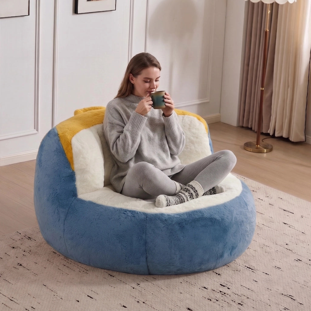 Poltrona pouf in pelliccia sintetica con imbottitura in schiuma, maniglia e fondo antiscivolo, multicolore