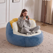 Poltrona pouf in pelliccia sintetica con imbottitura in schiuma, maniglia e fondo antiscivolo, multicolore