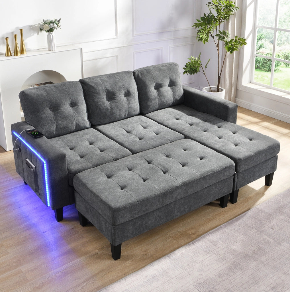 Divano letto a L 3 posti in ciniglia grigio antico con pouf mobile; LED e USB