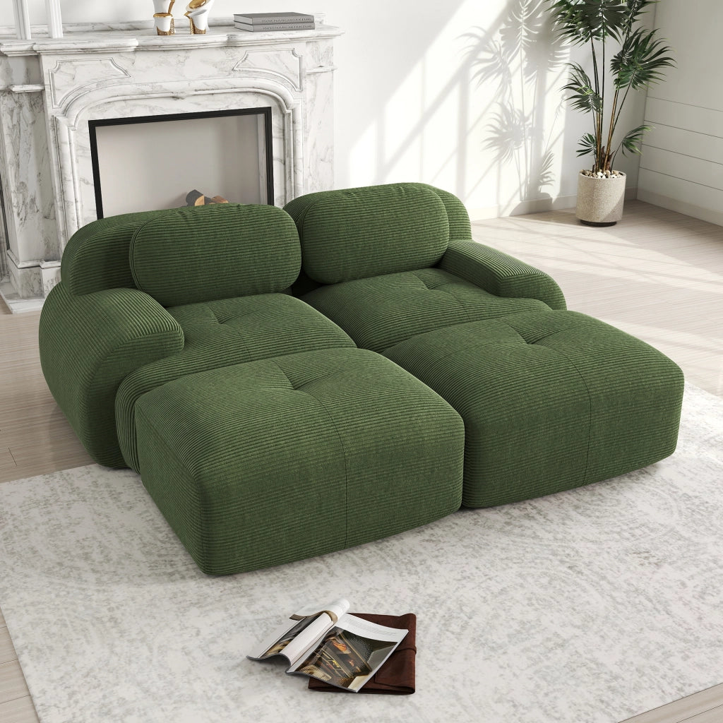 Divano angolare modulare senza struttura in tessuto a coste con braccioli ergonomici e base antiscivolo verde