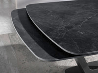 Tavolo da pranzo allungabile barile ovale marmo porcellanato e acciaio nero