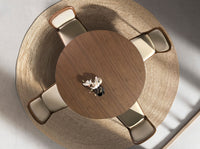 Tavolo da pranzo rotondo in noce e acciaio metallizzato color sabbia