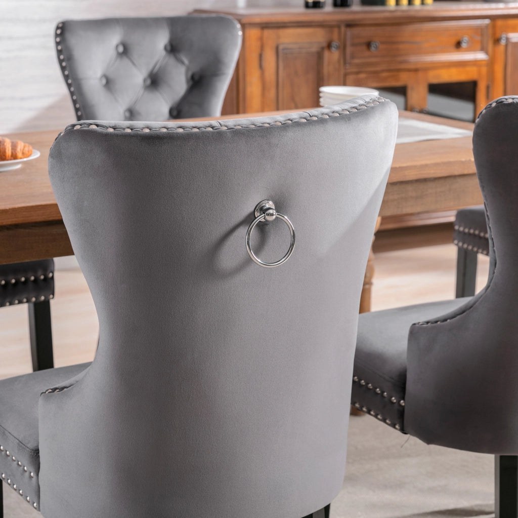 Set di 4 sedie da pranzo in velluto grigio con gambe in legno di gomma