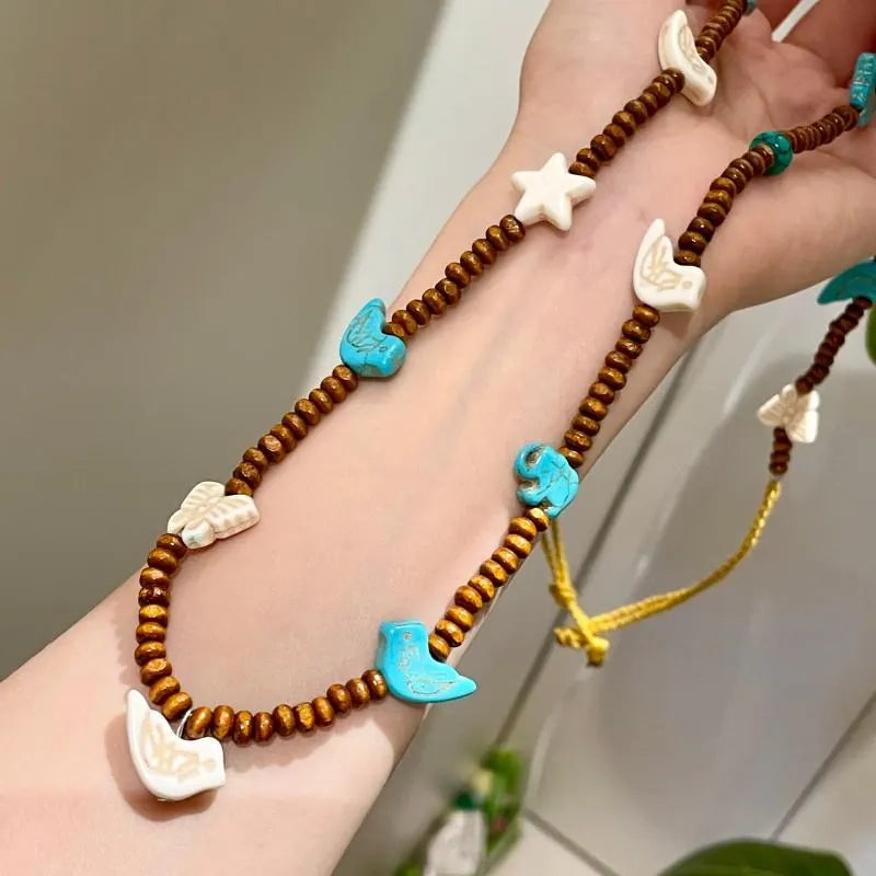 Collana vintage con farfalla e perline: ciondolo a stella in legno fatto a mano