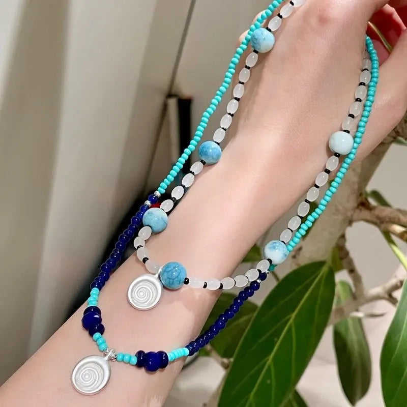 Collana con ciondolo a forma di conchiglia in pietra naturale: gioielli boho con perline