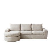 Divano modulare con ottomano mobile e cuscini in chenille beige