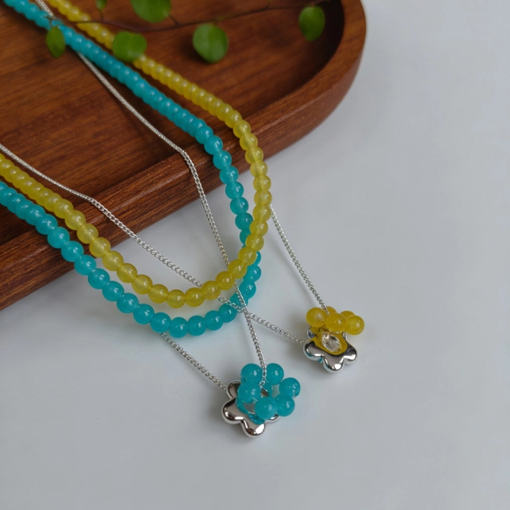 Collana a strati con fiori occhio di gatto