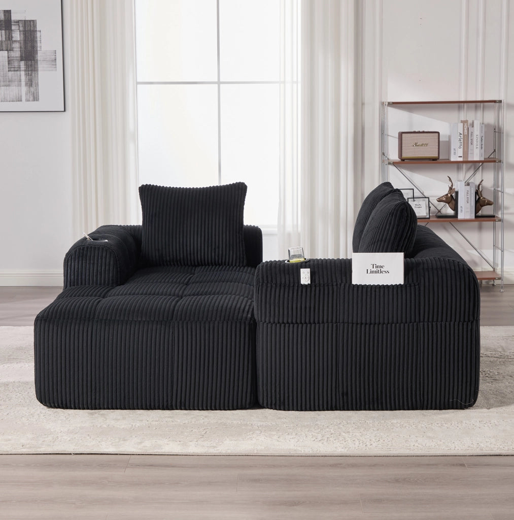 Divano compatto in velluto a coste nero con modulo personalizzabile, portabicchieri e tasche laterali, con 3 cuscini inclusi