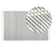 Tappeto in lana beige e grigio a mano con motivo geometrico e nappe 200 x 300 cm soggiorno camera da letto