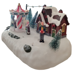 Villaggio Natalizio con Luci Musica Movimento 26cm Parco Giochi o Giostrina